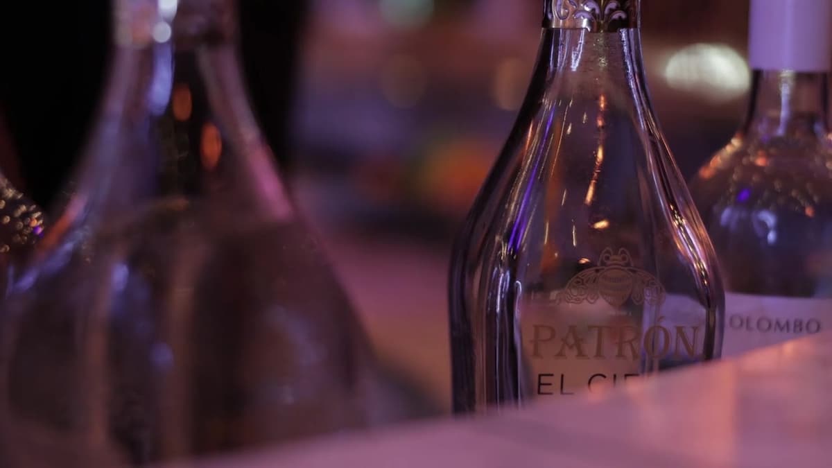 Patron El Cielo Austin film still. Close frame on the gold-etched Patron El Cielo bottle.